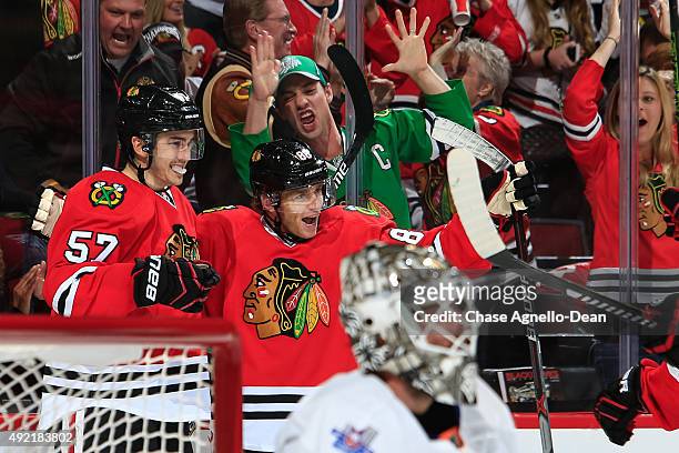 Patrick Kane of the Chicago Blackhawks celebrates with Trevor van Riemsdyk after scoring against the New York Islanders in the second period of the...