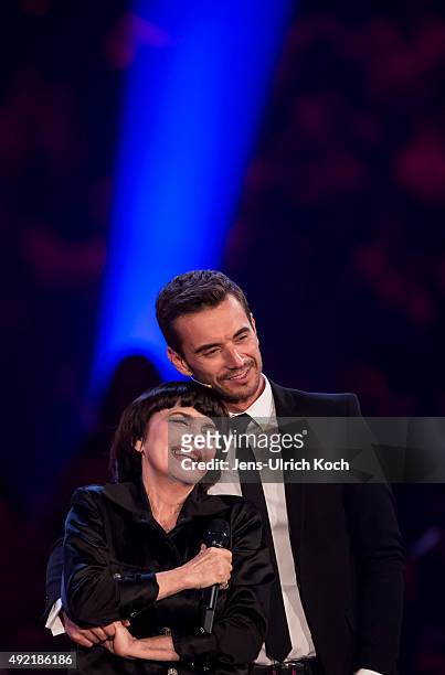 Mireille Mathieu and Florian Silbereisen perform during the tv show '150 Jahre Schlager - Das Grosse Fest Zum Jubilaeum' at Messe Erfurt on October...