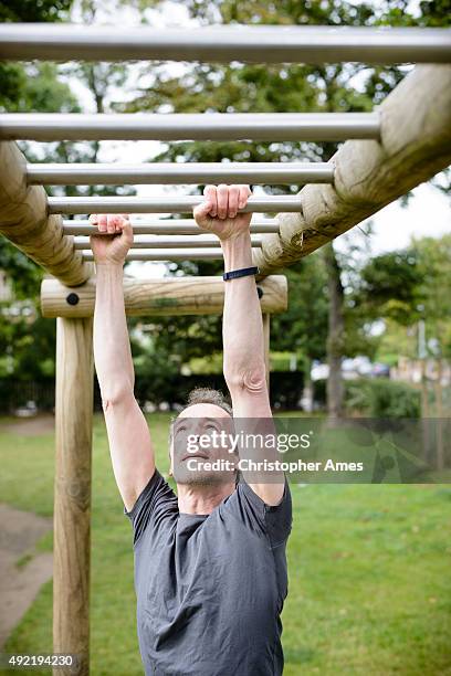 circuit training in city park - horizontal ladder - circuit training stock pictures, royalty-free photos & images