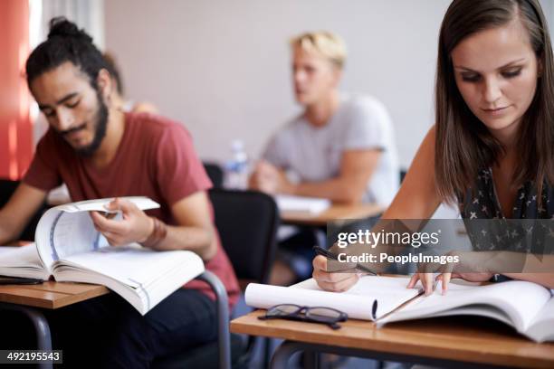 they're showing a dedication to education - exam hall stock pictures, royalty-free photos & images