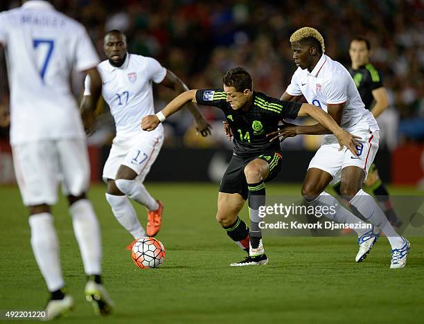 Javier Hernandez of Mexico drives the ball against Gyasi Zardes of the United States during the first half of the 2017 FIFA Confederations Cup...