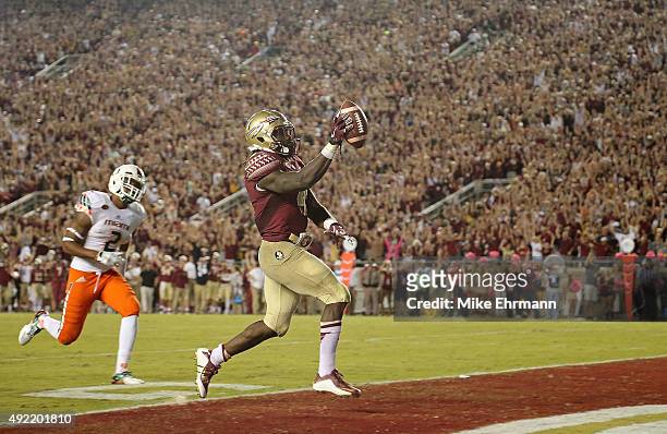 Dalvin Cook of the Florida State Seminoles rushes for a touchdown during a game against the Miami Hurricanes at Doak Campbell Stadium on October 10,...