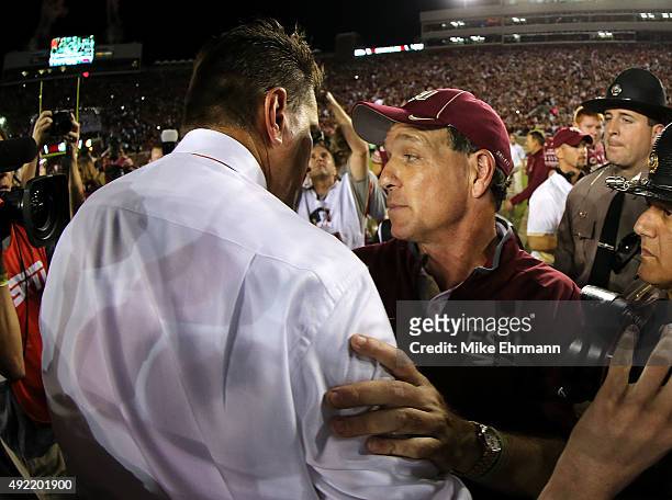 Head coach Jimbo Fisher of the Florida State Seminoles shakes hands with head coach Al Golden of the Miami Hurricanes following a game at Doak...
