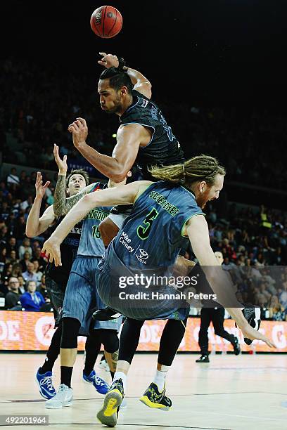 Tai Wesley of the Breakers falls over the top of Luke Schenscher of the Crocodiles during the round one NBL match between the New Zealand Breakers...