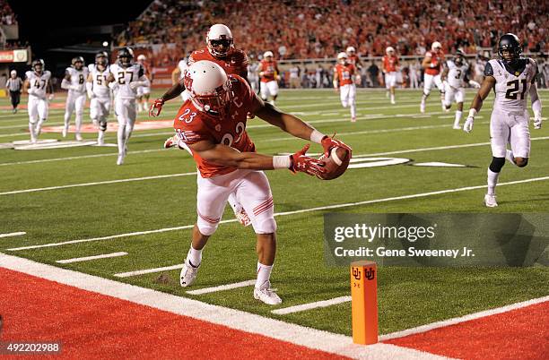 Running back Devontae Booker of the Utah Utes scores a first quarter touchdown against the California Golden Bears at Rice-Eccles Stadium on October...