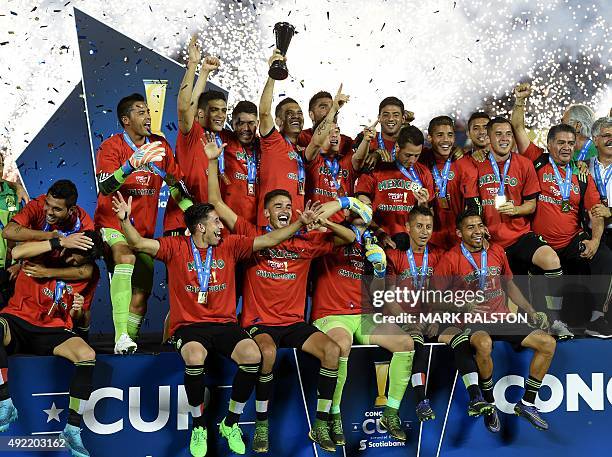 Members of the Mexico team celebrate after defeating the USA during their 2015 CONCACAF Cup match at the Rose Bowl in Pasadena, California on October...