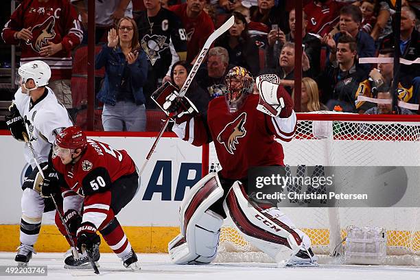 Goaltender Mike Smith of the Arizona Coyotes celebrates after defeating the Pittsburgh Penguins 2-1 in the NHL game at Gila River Arena on October...
