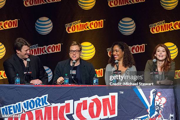 Actors Nathan Fillion, Alan Tudyk, Gina Torres and Jewel Staite attend the "Firefly Reunion" panel during New York Comic-Con Day 3 at The Jacob K....