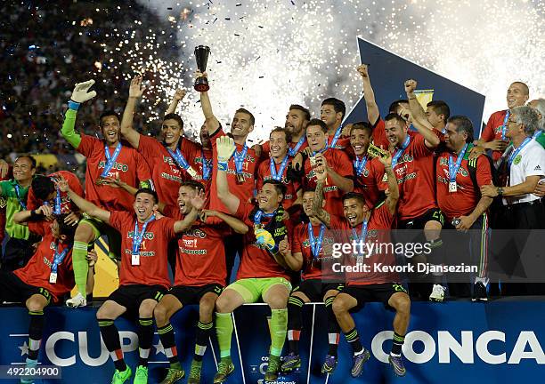 Rafael Marquez of Mexico holds up the trophy as he celebrates with his teammates after defeating the United States 3-2 during the 2017 FIFA...