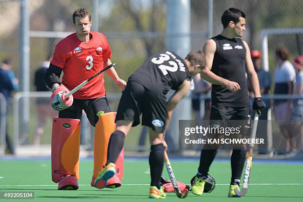 Kyle Pontifex, Nick Wilson and Nick Ross of New Zealand reacting following the international men's hockey test match between the New Zealand Black...