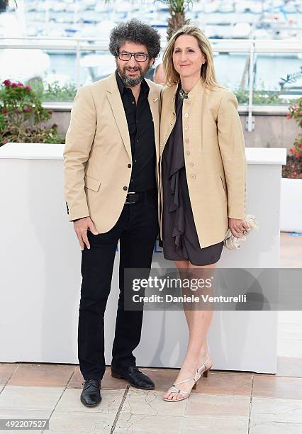 Producer Radu Mihaileanu and director Stephanie Valloatto attend the "Cartoonists - Foot Soldiers Of Democracy" photocall at the 67th Annual Cannes...