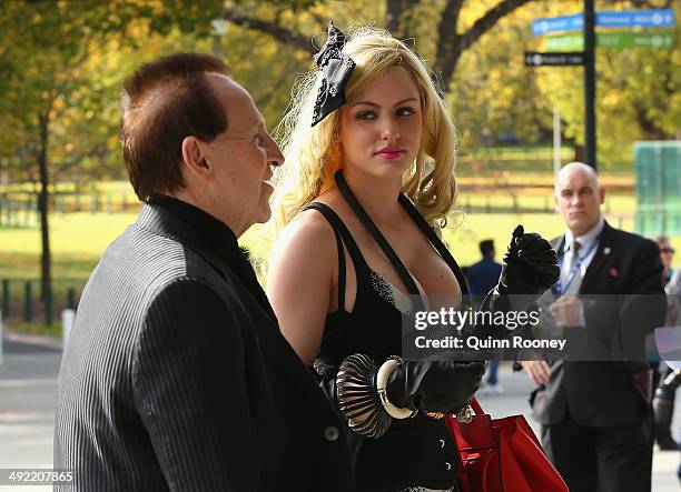 Geoffrey Edelsten and Gabi Grecko arrive for the public service for Tom Hafey at Melbourne Cricket Ground on May 19, 2014 in Melbourne, Australia....