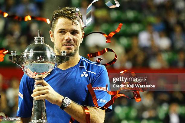 Stan Wawrinka of Switzerland celebrates with his trophy after winning the men's singles final match against Benoit Paire of France on Day Seven of...