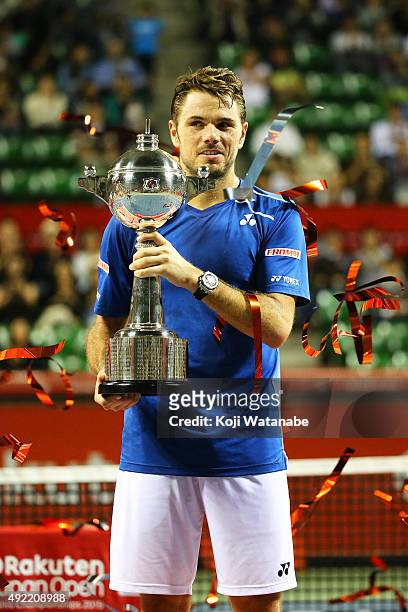 Stan Wawrinka of Switzerland celebrates with his trophy after winning the men's singles final match against Benoit Paire of France on Day Seven of...
