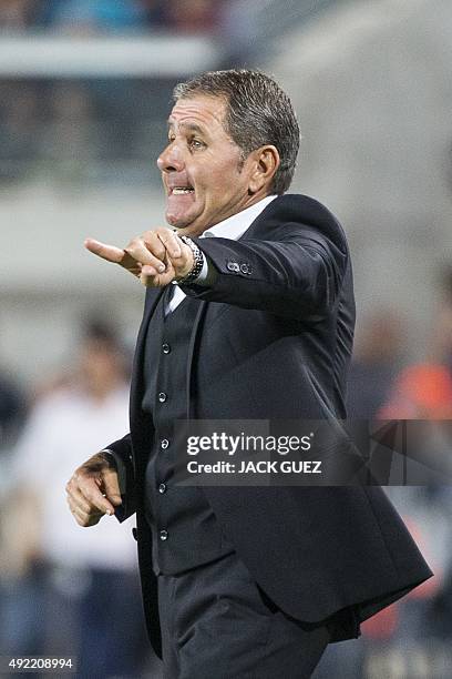 Israeli football team's Head Coach, Elie Gutman talks to his players during their Euro 2016 qualifying football match between Israel and Cyprus at...