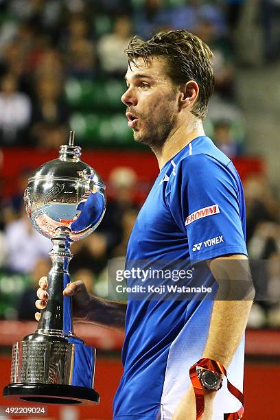 Stan Wawrinka of Switzerland celebrates with his trophy after winning the men's singles final match against Benoit Paire of France on Day Seven of...