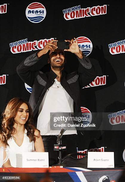 Summer Bishil and Arjun Gupta attend 'The Magicians' panel during New York Comic-Con 2015 at The Jacob K. Javits Convention Center on October 10,...