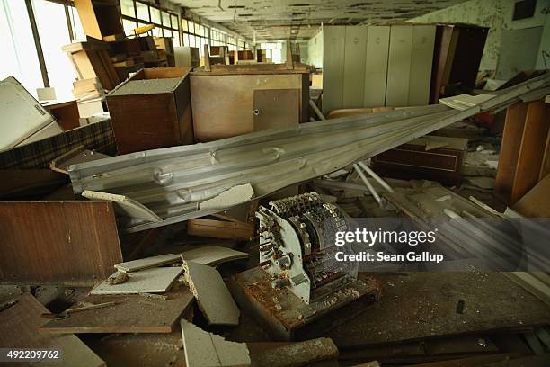 Rusting cash register lies in a looted and abandoned furniture store on September 29, 2015 in Pripyat, Ukraine. Pripyat lies only a few kilometers...