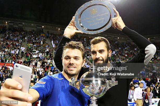 Winner Stan Wawrinka of Switzerland and runner-up Benoit Paire of France take a selfie after the men's singles final match on Day Seven of the...