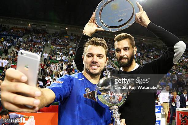 Winner Stan Wawrinka of Switzerland and runner-up Benoit Paire of France take a selfie after the men's singles final match on Day Seven of the...