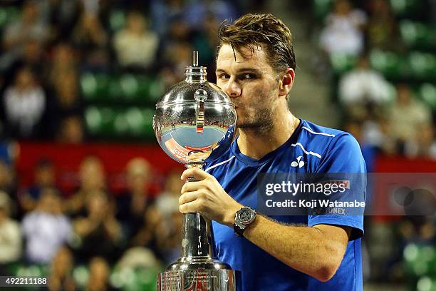 Stan Wawrinka of Switzerland celebrates with his trophy after winning the men's singles final match against Benoit Paire of France on Day Seven of...