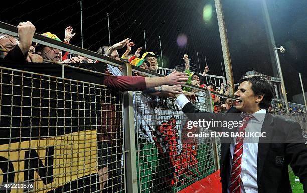 Wales' head-coach Chris Coleman greet supporters after the Euro 2016 qualifying football match between Bosnia and Herzegovina and Wales, in Zenica,...