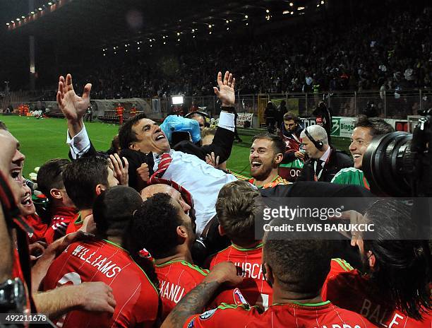 Wales' head-coach Chris Coleman celebrates with his team after the Euro 2016 qualifying football match between Bosnia and Herzegovina and Wales, in...