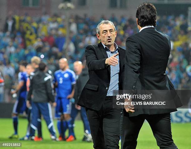 Bosnia and Herzegovina's head-coach Mehmed Bazdarevic shakes hands with Wales' head-coach Chris Coleman after the Euro 2016 qualifying football match...