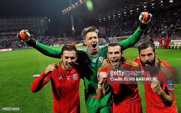 Wales' goalkeeper Wayne Hennessey , midfielder Gareth Bale , midfielder Joe Ledley and midfielder Aaron Ramsey salute supporters after the Euro 2016...