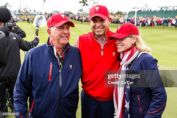 Team USA Captain Jay Haas, Bill Haas and Jan Haas pose for photos following the U.S. Team's victory against the International Team during Sunday...