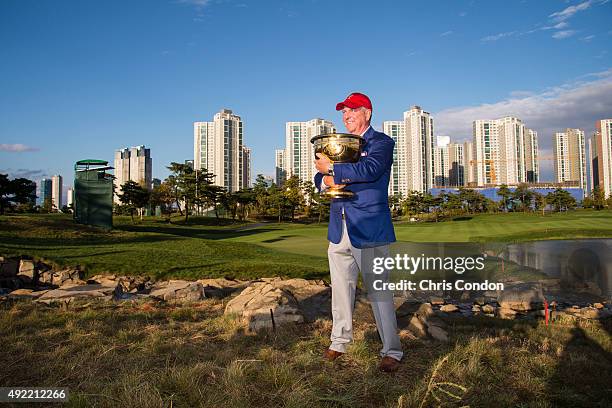 Team USA Captain Jay Haas poses with the Presidents Cup trophy following his team's one point victory against the International Team during Sunday...