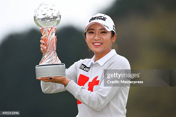 Bo-Mee Lee of South Korea poses with trophy after winning the Stanley Ladies Golf Tournament at the Tomei Country Club on October 11, 2015 in Susono,...