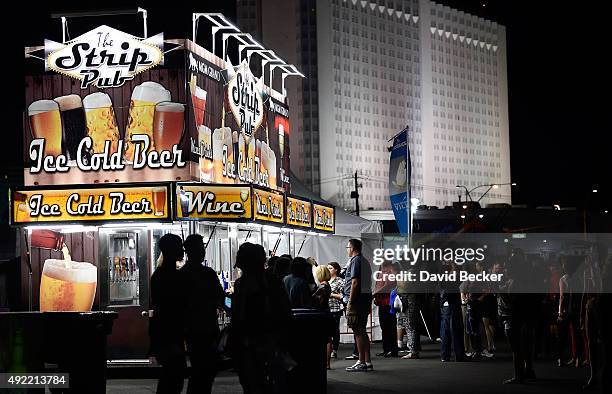 Guests line up at the food and drink booths during the 10th annual Wine Amplified festival at the Las Vegas Village on October 10, 2015 in Las Vegas,...