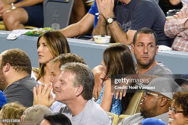 Jackie Sandler, Sunny Madeline Sandler and Adam Sandler attend game two of the National League Division Series between the Los Angeles Dodgers and...