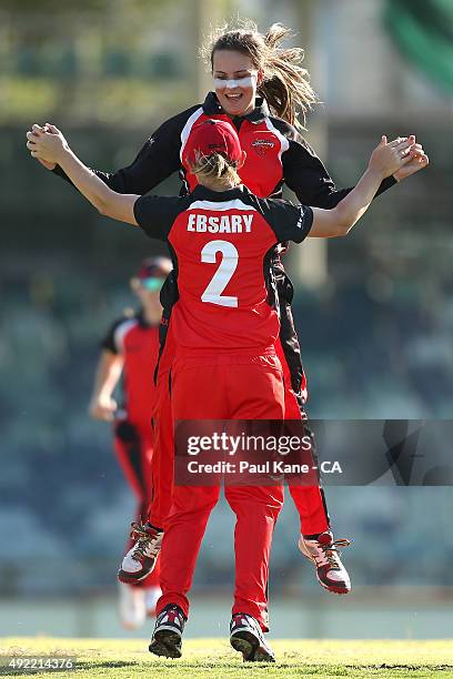 Alex Price of South Australia celebrates with Lauren Ebsary after dismissing Nicole Bolton of Western Australia during the round one WNCL match...