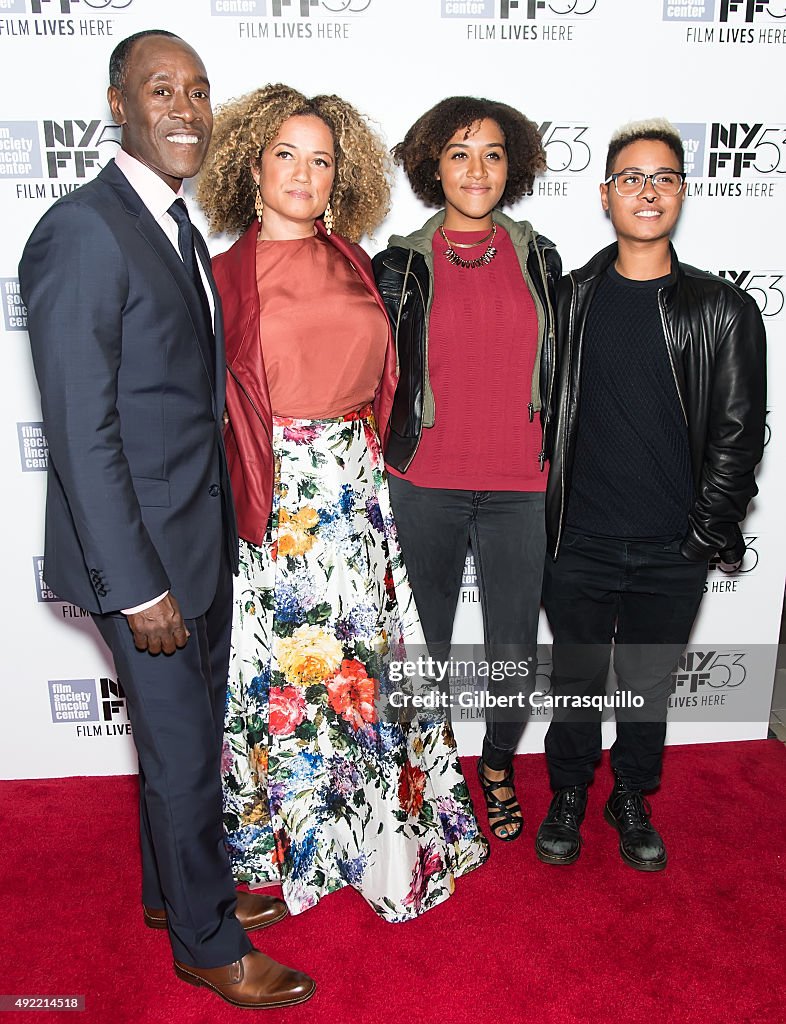 Actors Don Cheadle, Bridgid Coulter pose with their daughters Imani