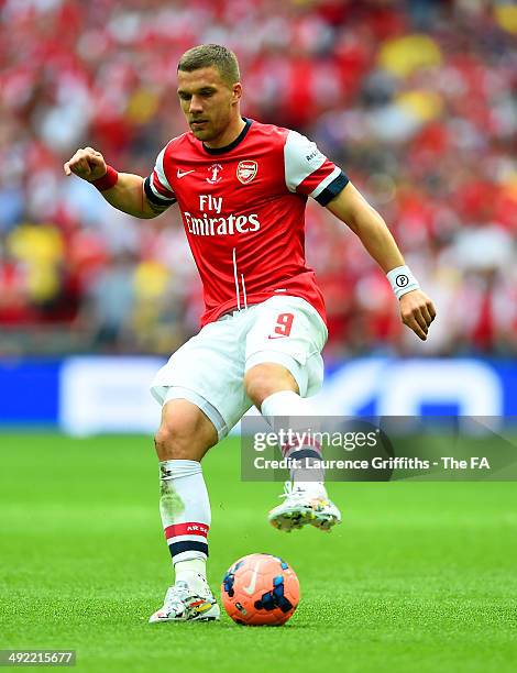 Lukas Podolski of Arsenal on the ball during the FA Cup with Budweiser Final match between Arsenal and Hull City at Wembley Stadium on May 17, 2014...