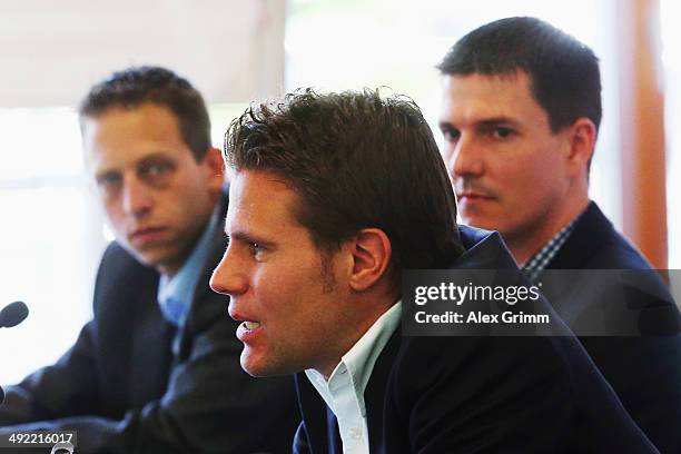 Referee Felix Brych and his assistant referees Stefan Lupp and Mark Borsch attend a press conference of the German FIFA 2014 World Cup referees at...