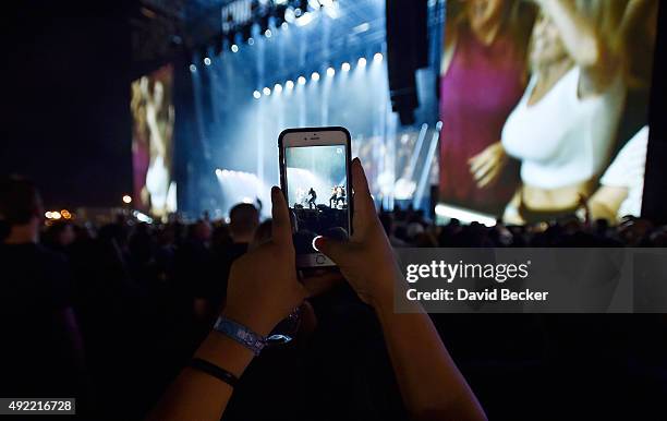 Fan photographs a musical act at the 10th annual Wine Amplified festival at the Las Vegas Village on October 10, 2015 in Las Vegas, Nevada.