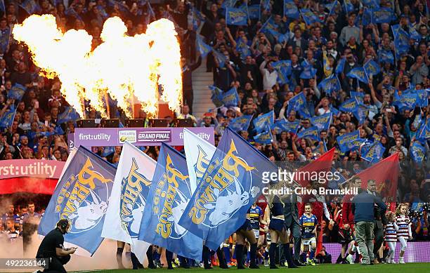 The Wigan Warriors and the Leeds Rhinos walk onto the field of play during the First Utility Super League Grand Final between Wigan Warriors and...