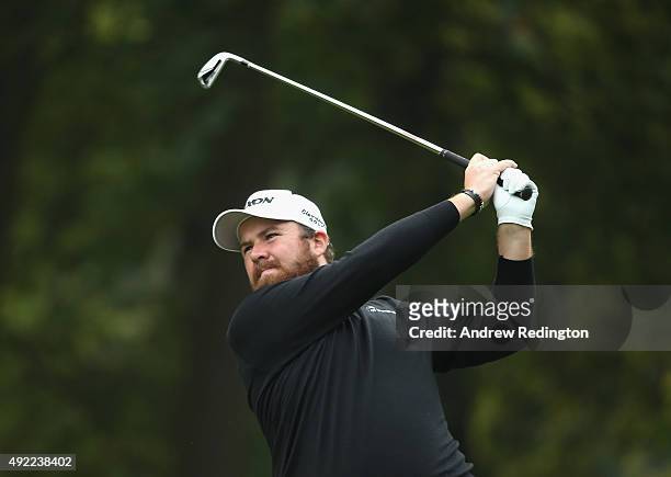 Shane Lowry of Ireland plays his second shot on the third hole during the final round of the British Masters supported by Sky Sports at Woburn Golf...