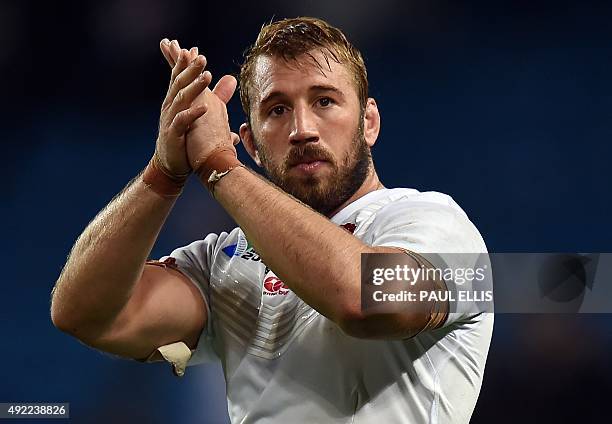 England's flanker and captain Chris Robshaw applauds the crowd at the end of the Pool A match of the 2015 Rugby World Cup between England and Uruguay...