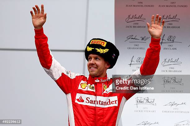 Sebastian Vettel of Germany and Ferrari celebrates on the podium after finishing second in the Formula One Grand Prix of Russia at Sochi Autodrom on...