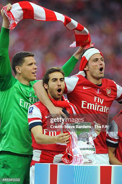 Wojciech Szczesny, Mathieu Flamini and Olivier Giroud of Arsenal celebrate during the FA Cup with Budweiser Final match between Arsenal and Hull City...