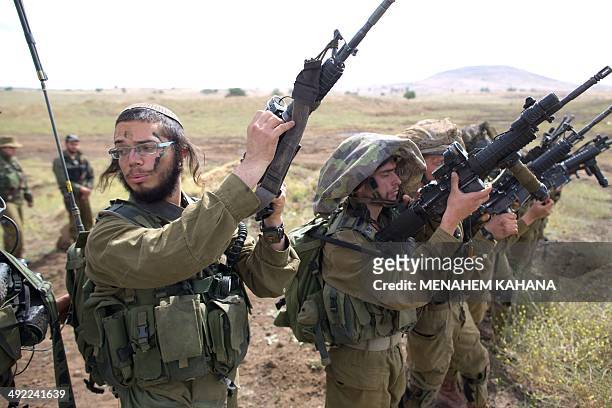 Israeli soldiers of the Ultra-Orthodox battalion "Netzah Yehuda" take part in their annual unit training in the Israeli annexed Golan Heights, near...