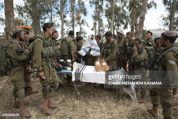 Israeli soldiers of the Jewish Ultra-Orthodox battalion "Netzah Yehuda" hold morning prayers as they take part in their annual unit training in the...