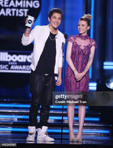 Austin Mahone and Cher Lloyd speak onstage during the 2014 Billboard Music Awards held at MGM Grand Garden Arena on May 18, 2014 in Las Vegas, Nevada.