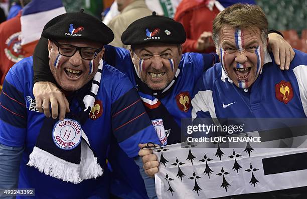 French rugby fans react as htey hold a Breton flag, or Flag of Brittany, ahead of a Pool D match of the 2015 Rugby World Cup between France and...