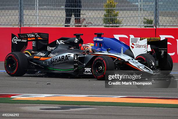 Marcus Ericsson of Sweden and Sauber F1 and Nico Hulkenberg of Germany and Force India get out of their cars after colliding during the Formula One...