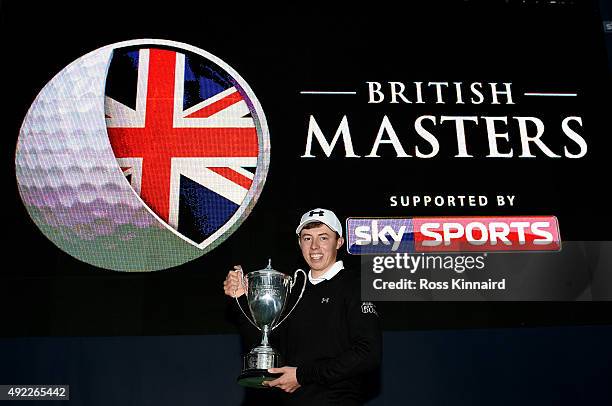 Matthew Fitzpatrick of England with the winners trophy after the final round of the British Masters at Woburn Golf Club on October 11, 2015 in...